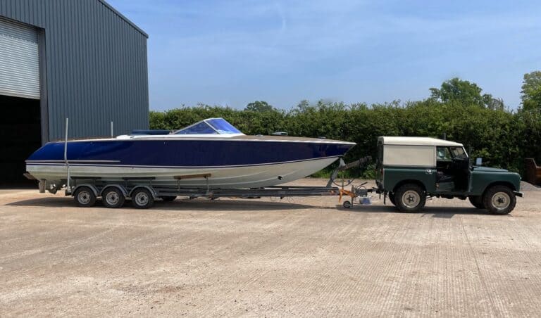 Fino 30 on trailer behind land rover